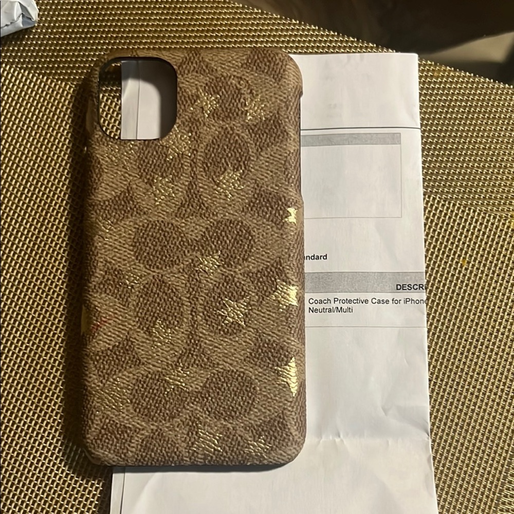 Coach Brown Cell Phone Case with Patterned Design and Textured Material